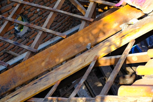 Industrial Photography. Construction Works. Photo of house debris after roof demolition. Roof removal for metal deck installation. Bandung, Indonesia