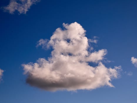 White fluffy clouds in the sky background. Cumulus clouds photo