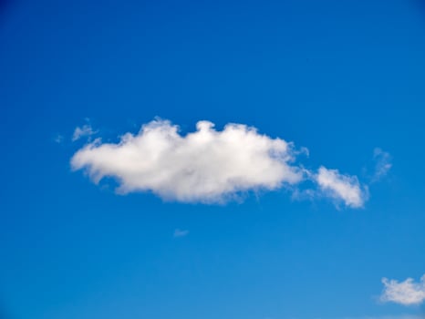 Cumulus clouds in the sky. Fluffy cloud shapes photo