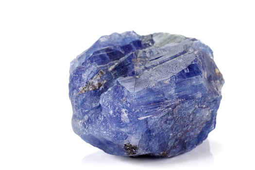 Macro blue tourmaline mineral stone on white background photo