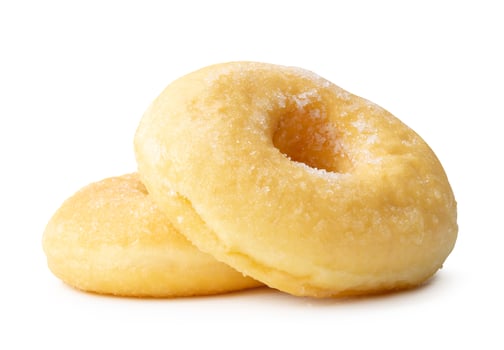 Side view of two sugar glazed cinnamon donuts in stack isolated on white background with clipping path photo