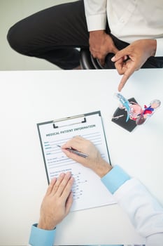 Doctors are counseling prostate cancer patients and using model of the penis to provide an example for prostate cancer patients about future symptoms and treatments. Prostate cancer treatment concepts photo