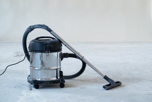 industrial vacuum cleaner at new house construction site, wide banner photo, space for text. Concept cleaning service and cleanup work. photo