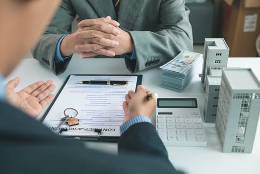 Real estate agents are selling real estate clients and offering condominiums buyers as long term rental investments help reduce burden paying installments. Investment property trading long term rental photo
