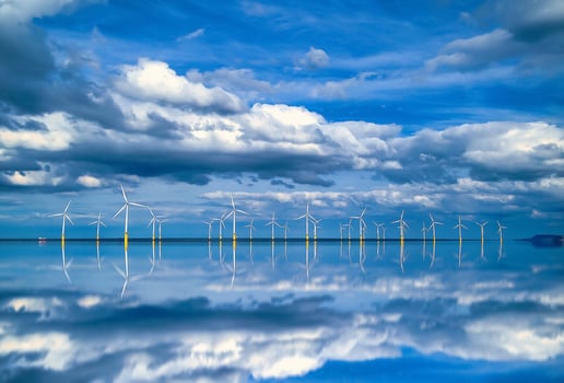 Offshore Wind Turbine in a Wind farm under construction off coast of England, UK photo