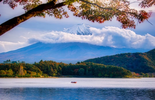 Landscape image of Mt. Fuji over Lake Kawaguchiko with autumn foliage at daytime in Fujikawaguchiko, Japan. photo