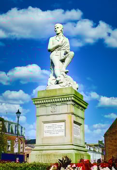 Robbie Burns statue on blue sky at Dumfries, Scotland. photo