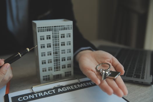 Real estate agent and customer signing contract to buy house, insurance or loan real estate.rent a house,get insurance or loan real estate or property. photo