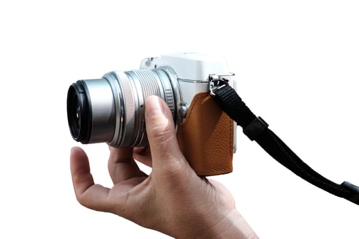 Close up hand holding vintage digital mirrorless camera photo