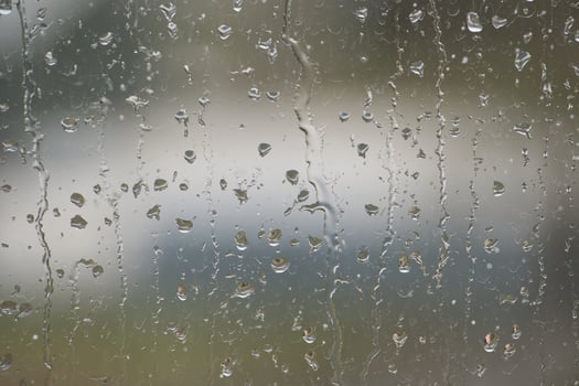 Window glass surface covered by water droplets photo