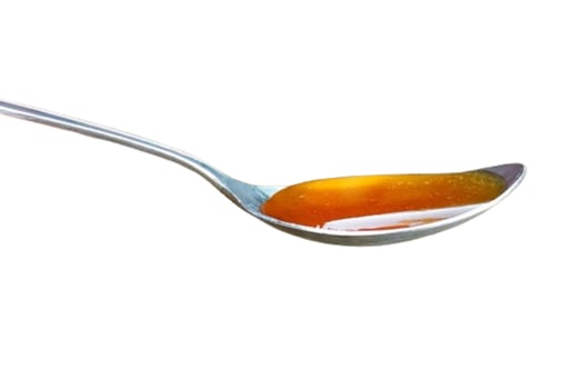 Spoon of honey isolated on white background photo