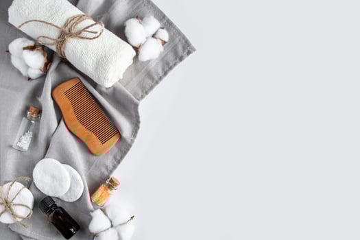 Set of natural cosmetics and spa accessories on white background. Towel, soap, hairbrush, essential oil. photo