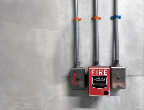 Red Emergency valve and phone jack on the concrete wall photo