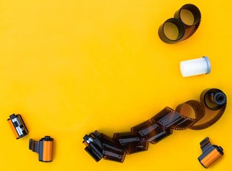film camera on yellow background photo