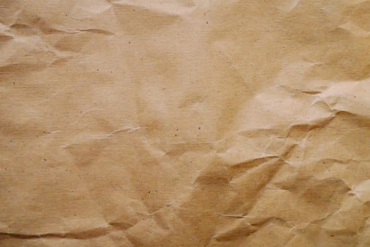 a brown paper texture with some holes photo