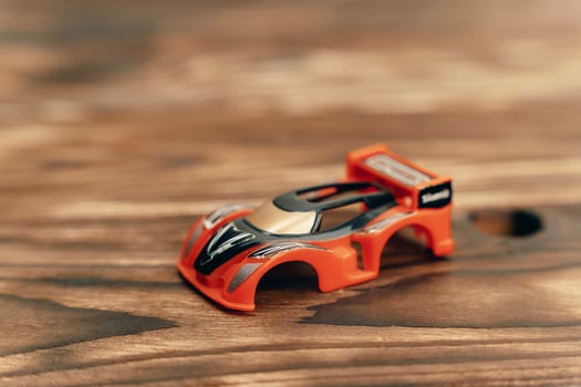 Toy Car on Wooden Table photo