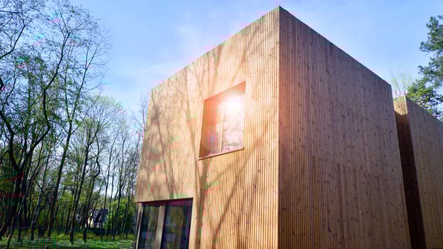 New single family house. Residential home with modern wooden facade. photo