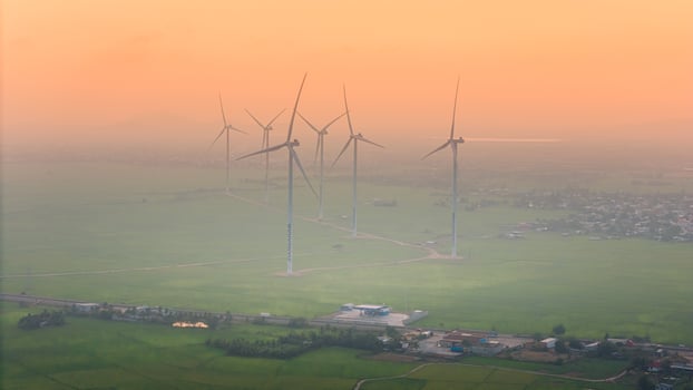 view of turbine green energy electricity, windmill for electric power production, Wind turbines generating electricity on rice field at Phan Rang, Ninh Thuan province, Vietnam photo
