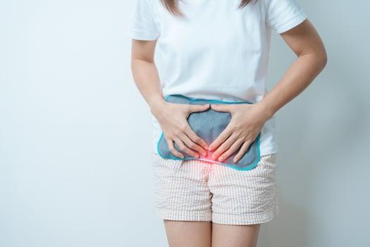 Menstruation period cycle of monthly and Stomachache concepts. woman having abdomen pain and menstrual ache with hot water bottle, illness female suffer from premenstrual ache and body Health problem photo