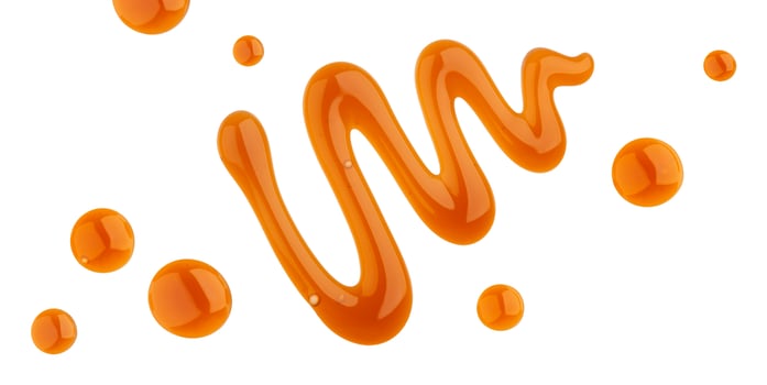 Caramel sauce isolated on white background, top view photo
