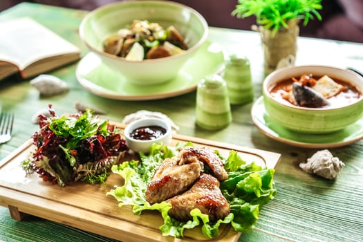 Abundant Wooden Cutting Board Displaying Assorted Food Items photo