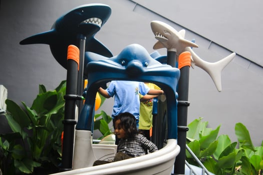 Kids having fun and sliding on outdoor playground. Kids Enjoying. Blue slide. enjoy for the game photo