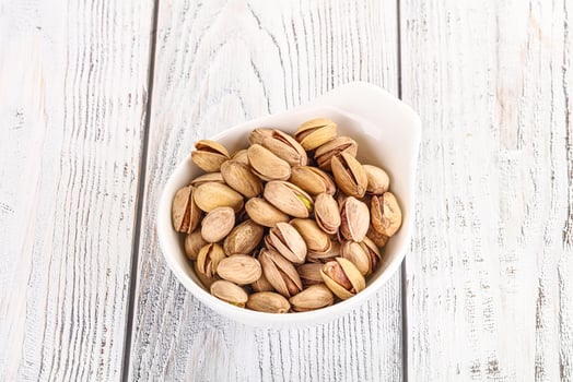 Salted tasty pistachio nuts heap photo