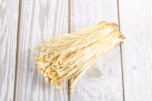 Tasty raw enoki mushroom heap photo