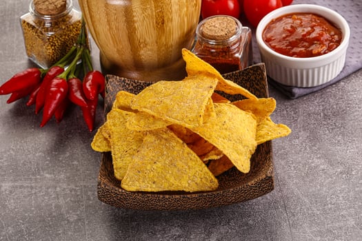 Mexican corn nachos chips with salsa photo