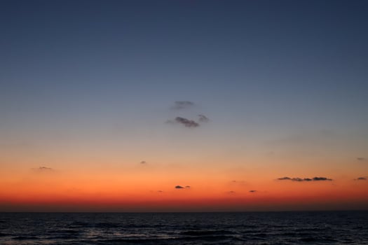 Lighting and color of the sky above the horizon at sunset. photo