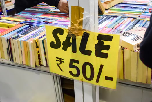 New Delhi, India, February 17 2024 - Variety of Books on shelf inside a book-stall at Delhi International Book Fair, Selection of books on display in Annual Book Fair at Bharat Mandapam complex photo