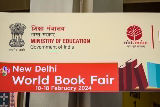 New Delhi, India, February 17 2024 - Variety of Books on shelf inside a book-stall at Delhi International Book Fair, Selection of books on display in Annual Book Fair at Bharat Mandapam complex photo
