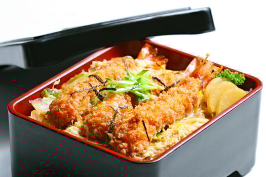 Ebi tempura don or Ebi Kakiage served with red pickled vegetables or Fukujin Zuke in white background photo