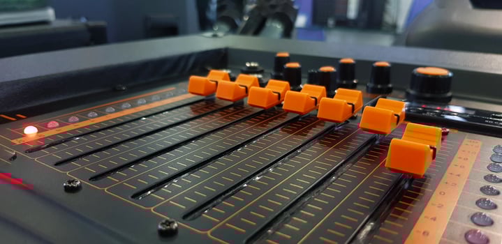 Close up orange button of sound mixer panel equipment for mixing or control audio system with selective focus technique. Technology, Tool and Digital device concept. photo