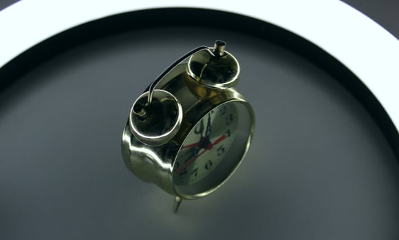 Vintage Alarm Clock On A Bedside With Soft Illumination At Early Morning photo