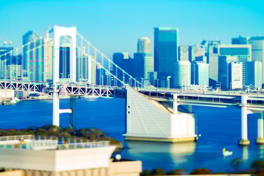 Rainbow bridge at the urban city in Tokyo tiltshift photo