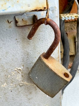 Rusted Metal Hook on White Wall photo
