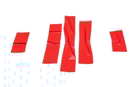 Top view set of wrinkled red adhesive vinyl tape or cloth tape in stripes isolated on white background with clipping path photo