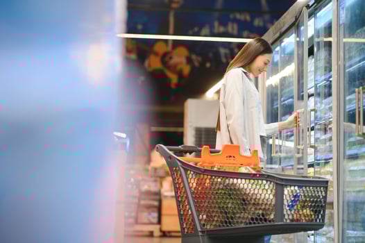 Young cool customer woman wear casual clothes shopping at supermaket store grocery shop photo