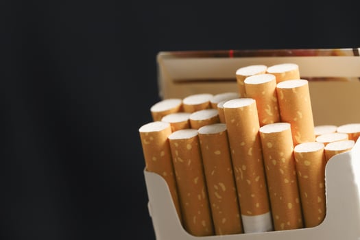 peel it off Cigarette pack prepare smoking on white wooden background. Packing line up. photo filters Natural light
