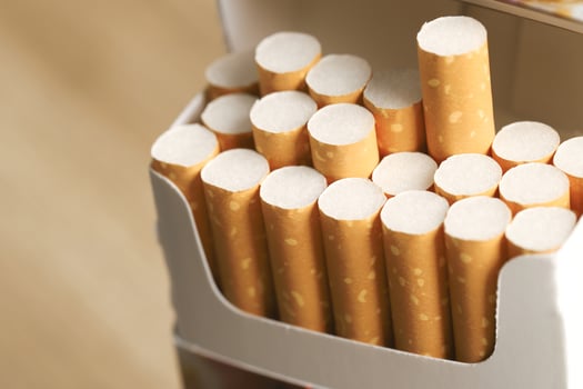 peel it off Cigarette pack prepare smoking on white wooden background. Packing line up. photo filters Natural light