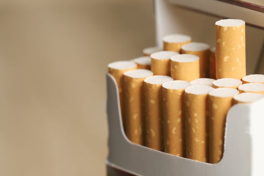 peel it off Cigarette pack prepare smoking on white wooden background. Packing line up. photo filters Natural light