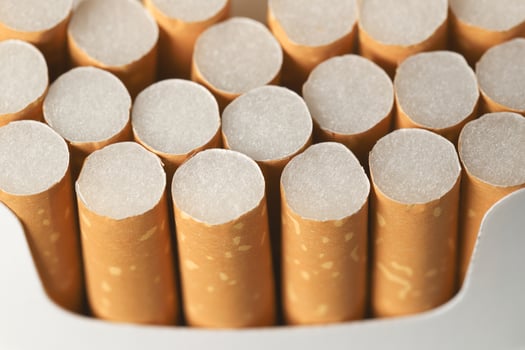 peel it off Cigarette pack prepare smoking on white wooden background. Packing line up. photo filters Natural light