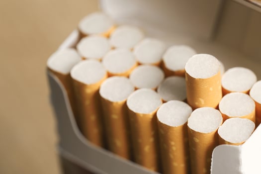 peel it off Cigarette pack prepare smoking on white wooden background. Packing line up. photo filters Natural light