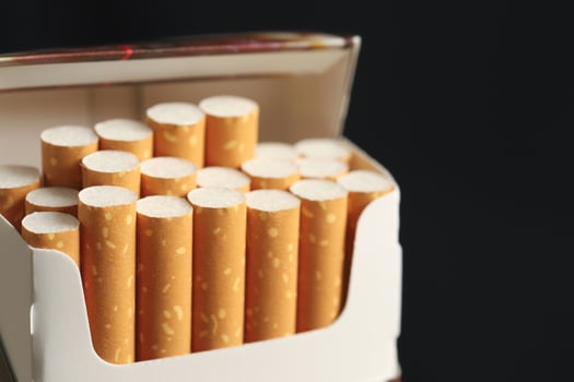 peel it off Cigarette pack prepare smoking on white wooden background. Packing line up. photo filters Natural light