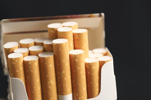 peel it off Cigarette pack prepare smoking on white wooden background. Packing line up. photo filters Natural light