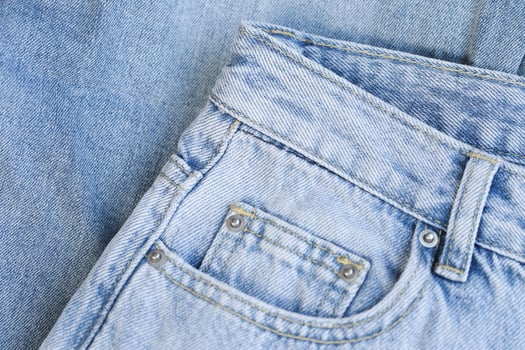 Fashionable denim jeans for teenagers texture background photo