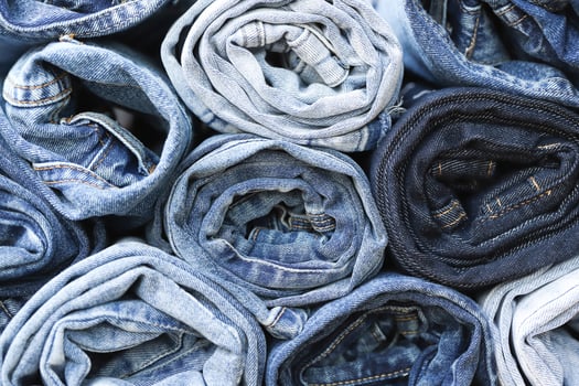 beautiful fashion jeans Stacked in layers at the jeans store photo