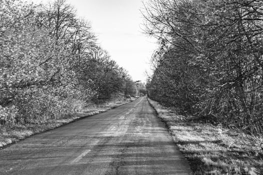 Beautiful empty asphalt road in countryside on colored background photo