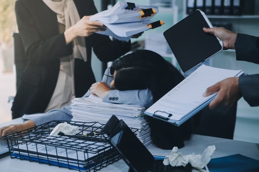 Stressful business man have so many paperwork in the office photo